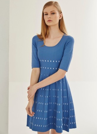 Two-tone knit dress with a subtle perforated design and a fully flared skirt. The dress itself has a striped design on the underside of inner face, plus a crew neck and short sleeves.
